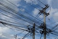 The chaos of cables and wires on electric pole in Bangkok, Thailand.