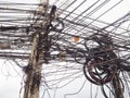 Chaos of cables and wires on electric pole Royalty Free Stock Photo