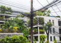 Chaos of cables and wires on electric pole in Thail Royalty Free Stock Photo