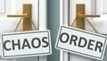 Chaos or order as a choice in life - pictured as words Chaos, order on doors to show that Chaos and order are different options to Royalty Free Stock Photo