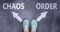 Chaos and order as different choices in life - pictured as words Chaos, order on a road to symbolize making decision and picking