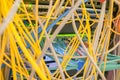 Chaotic intertwining of many Internet wires in the rack server room. Messy Communication cables are in the datacenter. Patch panel