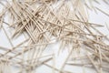 Chaotic pile of toothpicks on a white background