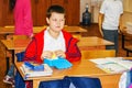Schoolboy in class at a Desk
