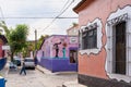 Artistic building facades painted by traditional Latin American style