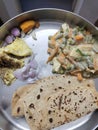 chapathi with vegetable white gravy, egg omelette and onions Royalty Free Stock Photo
