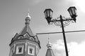 Chapel of Alexander Nevsky and street light. Black and white photo.