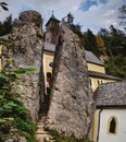 Chapel in Austria with split rock in the foreground