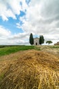 A chapel with cypresses in the center of the field. Church on a hill and green surroundings. Chapel of the Madonna di Royalty Free Stock Photo