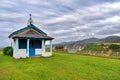 Chapel on the green mown clean lawn. Royalty Free Stock Photo