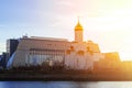 The chapel of the holy trinity of the Russian Orthodox Church and the building of the Surgut University in the rays