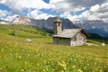 The Chapel of Mastle located near Raiser Pass, with Puez Odle mountain range on the left and Sella Group mountains on the right