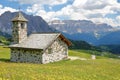 The Chapel of Mastle located near Raiser Pass, with Puez Odle mountain range on the left and Sella Group mountains on the right