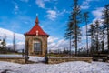 Chapel in the mountains for occasional worship with benches in winter beautiful suns day, czech beskydy , polomy