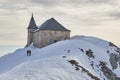 Chapel in the mountains in winter in Villach, Austria