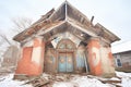 chapel with a partially collapsed roof and weathered walls