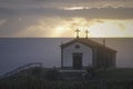 Chapel by the sea at sunset