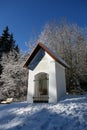 Chapel in the snow under blue sky