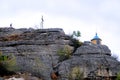 Chapel on top and wooden cross on a mountaintop