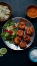 Chapli kabab served with fresh salad, a classic Indian dish