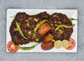 chapli kabab withlemon and tomato served in dish isolated on background top view of indian spices and pakistani food