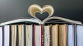 Chapter of Love, Heart Shaped Stack of Textbooks Holding an Open Love Story. Generative Ai