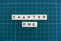 Chapter one word made of square letter word on green square mat background Royalty Free Stock Photo