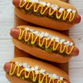 Char Grilled Hot Dog with Mustard, Relish and Onion on a rustic wooden board, top view. Close-up Royalty Free Stock Photo