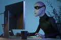 Character Hacker John Scammer in mask using PC committing online theft. Side view 3d rendering.