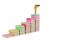 A character holding a binoculars on books,3D illustration. Royalty Free Stock Photo