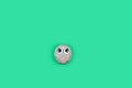 Character from a pebble on green blank background