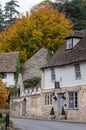 Characterful, historic houses in Castle Combe, picturesque village in Wiltshire in the Cotswolds, UK. Photographed in autumn.