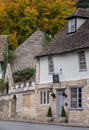 Characterful, historic houses in Castle Combe, picturesque village in Wiltshire in the Cotswolds, UK. Photographed in autumn.