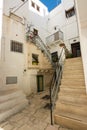 Characteristic alley and stairs in the historic center of Cisternino Italty Royalty Free Stock Photo