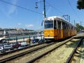 Traditional ancient yellow tramway along the Danube to Budapest in Hungary.