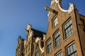 Characteristic clock facade and stepped gables along the Kloveniersburgwal in Amsterdam, the Netherlands