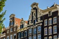 Characteristic clock facade and stepped gables along the Kloveniersburgwal in Amsterdam, the Netherlands