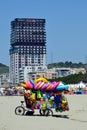Toys seller cart with plastic toys and beach balls on the sandy beach