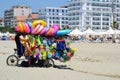 Toys seller cart with plastic toys and beach balls on the sandy beach