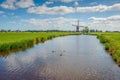 Characteristic Dutch polder landscape with a windmill