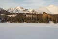 Characteristic Hotel in the High Tatras over the frozen Lake Strbske pleso and beautiful mountain view. Royalty Free Stock Photo