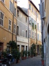 Characteristic narrow street in the historical center of Rome in Italy.