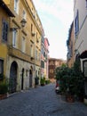 Characteristic narrow street of the district  Trastevere to Rome in Italy. Royalty Free Stock Photo