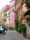 Characteristic narrow street of  the district Trastevere to Rome in Italy. Royalty Free Stock Photo