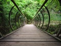 Characteristic pedestrian wooden bridge with a metal grating par Royalty Free Stock Photo
