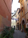 Characteristic street of the district Trastevere with suspended laundry to Rome in Italy. Royalty Free Stock Photo
