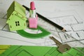 Young woman workplace. House building plan