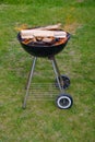 Charcoal barbecue grill, mobile brazier, burning wood