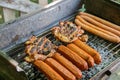Charcoal BBQ Barbecue Grill in backyard of country side, preparing, grilling sausages and chicken on grill Royalty Free Stock Photo
