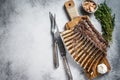 Charcoal Grilled French rack of Lamb Ribs Chops on cutting board. White background. Top view. Copy space Royalty Free Stock Photo